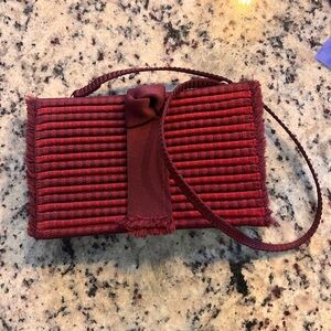 Rothy’s Ruby red tassel clutch
